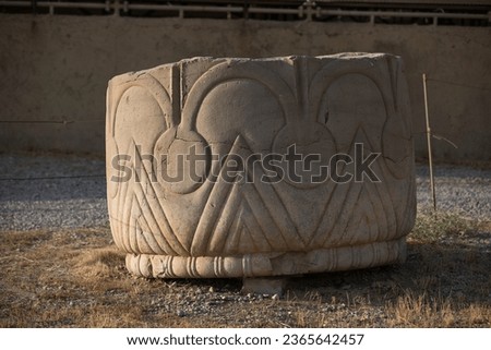 A fragment of an ancient column, Persepolis, the Achaemenid capital. Close-up of ancient pillar motifs Royalty-Free Stock Photo #2365642457