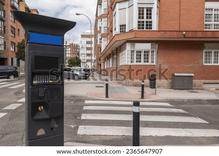 A controlled parking meter on a street in the city of Madrid, Spain