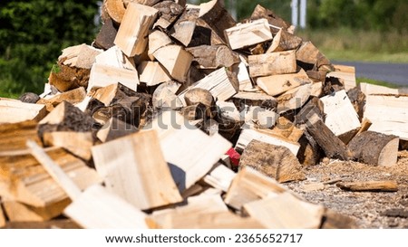 A large pile of beautifully cut wood on a bright bottom,aspect ratio 16:9