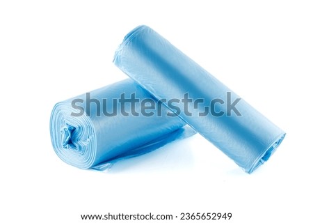 Rolls of blue plastic garbage bags isolated on white background. Full depth of field. Closeup