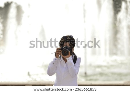 female photographer doing photo shoots