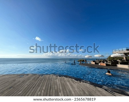 Infinity pool view of a beach club in a sunny day , Jimbaran, June 2023