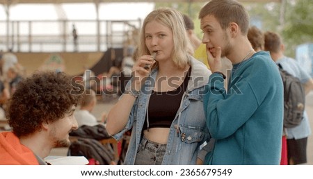 Portrait of modern young people. Vaping popular among youth alternative to smoking. Health risks and nicotine addiction are concerns. Lifestyle choice with ongoing debates and evolving regulations. Royalty-Free Stock Photo #2365679549