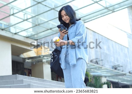 attractive beautiful asian young woman influencer enjoy recording video or vlogging or take a photo of a cup of coffee for small business social media content