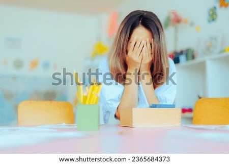 
Unhappy Preschool Teacher Feeling Tired and Overwhelmed. Kindergarten educator suffering from burnout being underpaid 
 Royalty-Free Stock Photo #2365684373