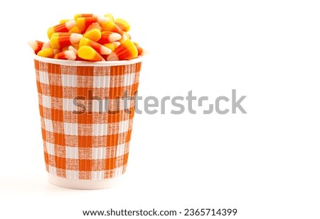 A Coffee Cup with Candy Corn Latte Isolated on a White Background