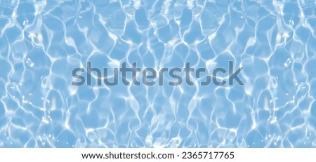 Defocus blurred transparent blue colored clear calm water surface texture with splashes reflection. Trendy abstract nature background. Water waves in sunlight with copy space. Blue watercolor shine. Royalty-Free Stock Photo #2365717765