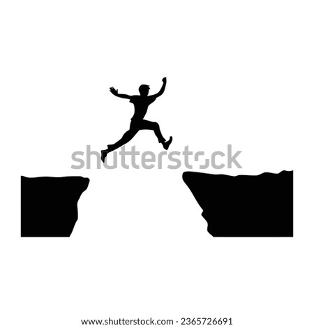 Man jumping over abyss between hill. Royalty-Free Stock Photo #2365726691