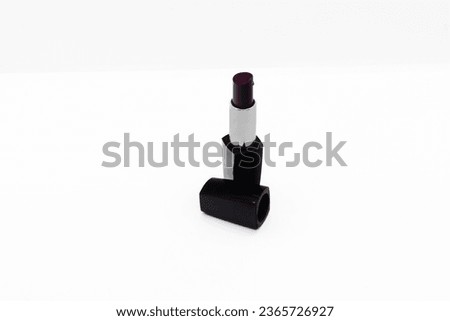 Dark red lipstick isolated on white
