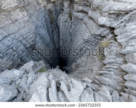 Details of deep pits, sharp rocks and dangerous areas where harsh winters took place Royalty-Free Stock Photo #2365732355
