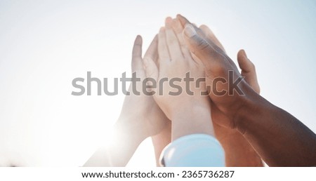 Hands, together and people with high five, huddle for support and solidarity in community with sun lens flare. Success, team building or collaboration with trust, partnership or alliance with synergy Royalty-Free Stock Photo #2365736287