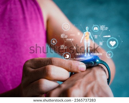Mid adult man using smart watch during training. Heart monitor beats with wristwatch. smart watch or future data on healthcare. technology in use of smart watch for health condition. Royalty-Free Stock Photo #2365737283