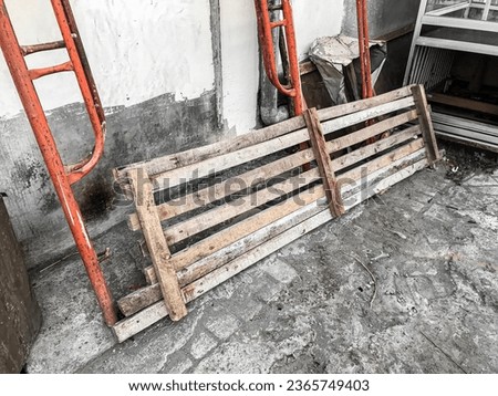 wooden planks and tall iron chairs lay on the terrace. board, carpenter, carpentry, oak, fence, floor, home, furniture, material, structure, construction, timber, wall, lumber, rough, surface