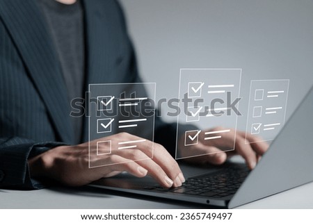 Online survey form concept, Businessman makes checklist and takes an online assessment test on laptop. filling survey form, answer questions of test.