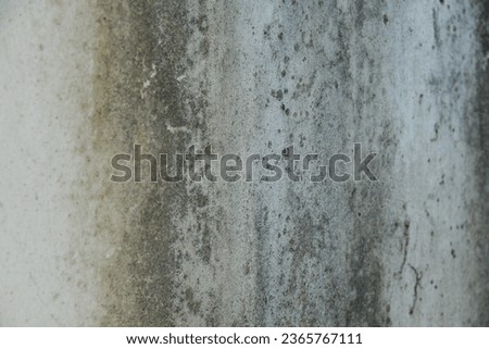 Background image: stained, dirty wall