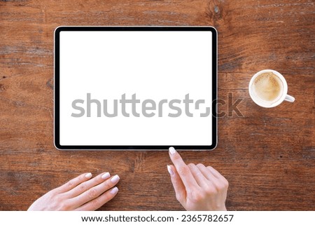 Woman using tablet computer with empty screen, view from above