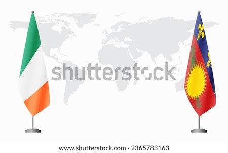Ireland and Guadeloupe flags for official meeting against background of world map.