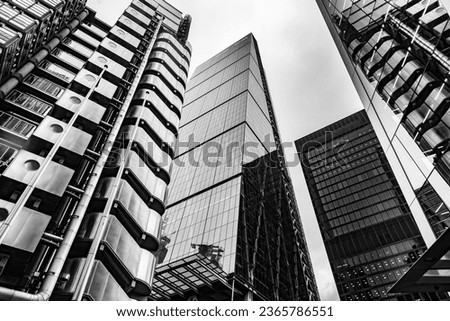 Modern black and white abstract reflections in glass fronted office buildings in the financial district of the British capital London. 