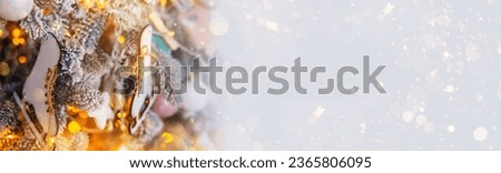 Christmas background. Festive Fir Tree Decorated in Radiant Blue and Ornaments, Surrounded by Garland Lights