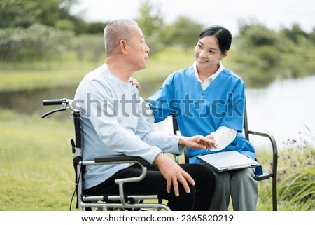 Portrait of female nurse touching patient's and reassurings houlder to encourage treatment.