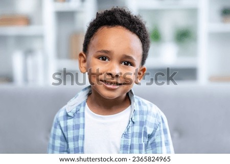 Happy face little boy smiling, Portrait funny cute kid joyful laughing and looking to camera, headshot