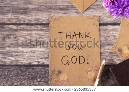 Thank You, God, handwriting on old vintage paper with rustic pen and holy bible book on wooden background. Top table view. Christian thanksgiving, gratitude, blessing, and praise to Jesus Christ.