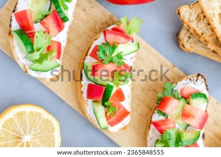 Savor the vibrant colors and fresh flavors of our delectable bruschetta. A symphony of ripe tomatoes, fragrant basil, and crusty bread, captured in a single enticing image.