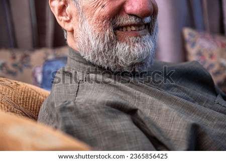 old man face smiling with bearded face in grey color