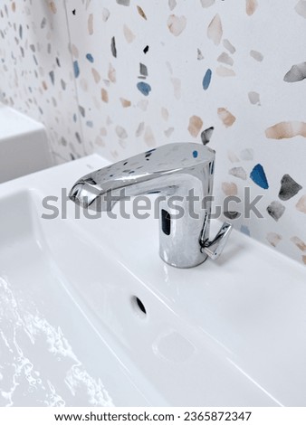 modern hotel bathroom, white ceramic sink with chrome metal faucet, sink fixture, bathroom detail, luxury hotel bathroom, white sink, chrome faucet, modern design for black and white restrooms