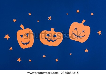 Happy Halloween, Pumpkin smile and star make from paper cut on dark blue background, Halloween concept