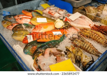 Fresh seafood at the interesting tropical market, Makishi Public Market.

Ama Beach, Zamami Island, Zamami Vil., Shimajiri, Okinawa, Japan.
Photo Taken November 25, 2022.
 Royalty-Free Stock Photo #2365892477