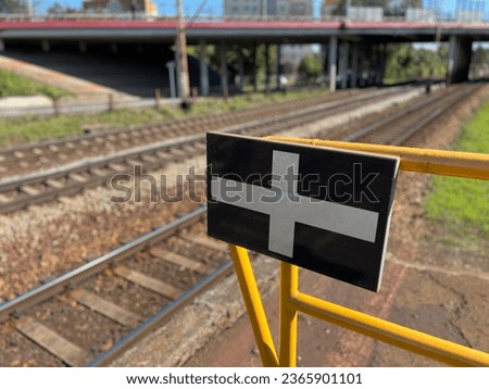 A sign on the platform, a symbol of the end of the platform, railway markings, a sign for a locomotive to stop Platform designation, Railroad symbol, Train station indicator, Railroad safety measures