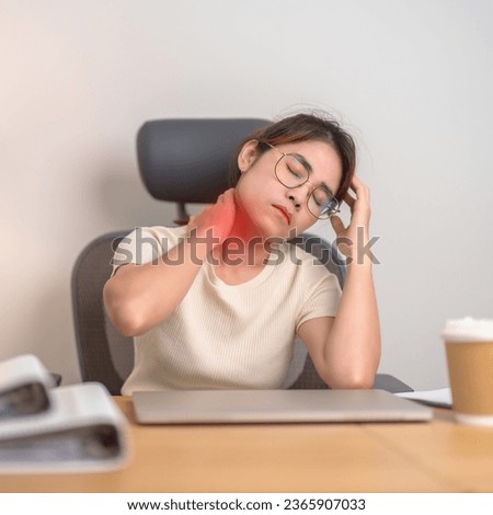 Woman having Neck and Shoulder pain during work long time on workplace. due to fibromyalgia, rheumatism, Scapular pain, office syndrome and ergonomic concept Royalty-Free Stock Photo #2365907033