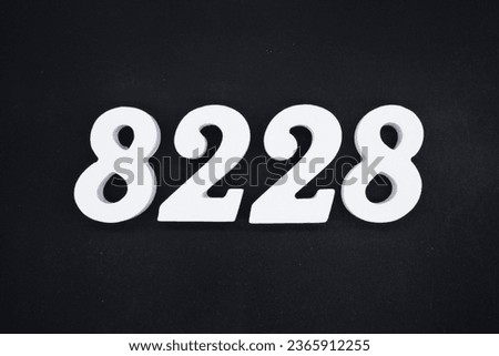 Black for the background. The number 8228 is made of white painted wood.