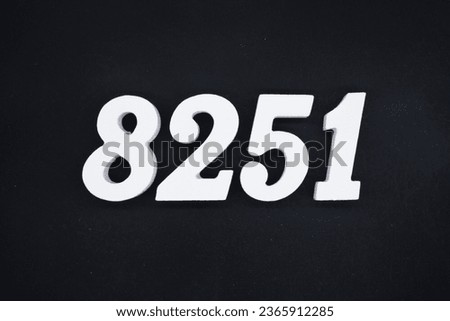 Black for the background. The number 8251 is made of white painted wood.