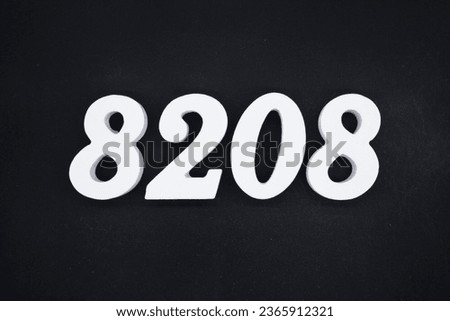 Black for the background. The number 8208 is made of white painted wood.