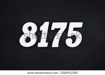 Black for the background. The number 8175 is made of white painted wood.
