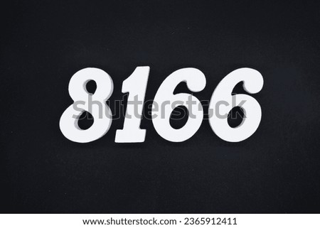 Black for the background. The number 8166 is made of white painted wood.