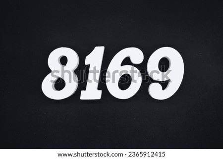 Black for the background. The number 8169 is made of white painted wood.