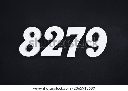 Black for the background. The number 8279 is made of white painted wood.