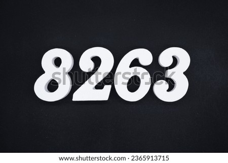 Black for the background. The number 8263 is made of white painted wood.