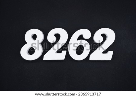 Black for the background. The number 8262 is made of white painted wood.