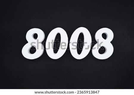 Black for the background. The number 8008 is made of white painted wood.