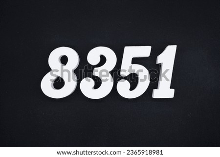 Black for the background. The number 8351 is made of white painted wood.