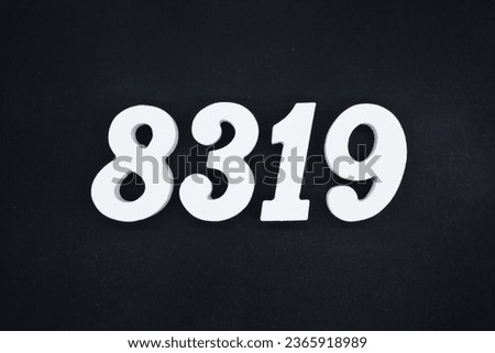 Black for the background. The number 8319 is made of white painted wood.