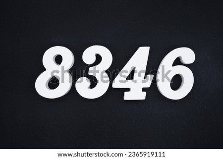Black for the background. The number 8346 is made of white painted wood.