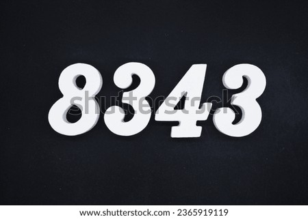 Black for the background. The number 8343 is made of white painted wood.