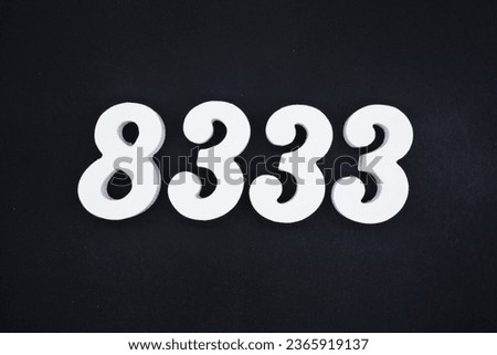 Black for the background. The number 8333 is made of white painted wood.
