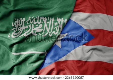 big waving realistic national colorful flag of saudi arabia and national flag of puerto rico . macro