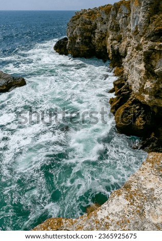 Seascape on the Black Sea, high steep stone coast with inaccessible rocks near the village of Tyulenovo, Bulgaria